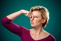 Woman closing her nose because of bad smell. People,lifestyle an Royalty Free Stock Photo