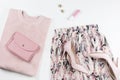 Woman clothes and accessories - skirt, sweater, pumps in pastel pink colors