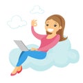 A woman on a cloud working on a laptop and showing ok sign. Royalty Free Stock Photo