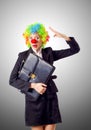 Woman clown in business suit