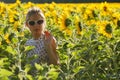 Woman clowns in the sunflowers