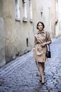 Woman at coat with handbag at her minds Royalty Free Stock Photo