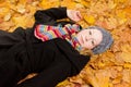 Woman coat scarf maple leaves Royalty Free Stock Photo