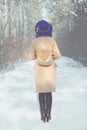 Woman walking in winter in the forest. Royalty Free Stock Photo