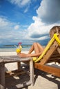 Woman with a cocktail on beach Royalty Free Stock Photo