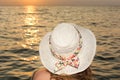 Woman with coconut cocktail by the beach Royalty Free Stock Photo