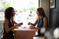 Woman at coffe shop table Royalty Free Stock Photo