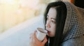 woman coffee with hand holding a cup in cafe, young woman drinking coffee or tea relaxed woman smelling coffee at home in winter Royalty Free Stock Photo