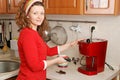 Woman with coffee machine Royalty Free Stock Photo