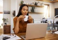 Woman with coffee, remote work and laptop, reading or review with freelance employee drinking hot beverage and content Royalty Free Stock Photo