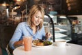 Woman In Coffee Shop Sitting At Table Eating Healthy Lunch Royalty Free Stock Photo