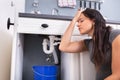 Woman Collecting Leaking Water In Bucket Royalty Free Stock Photo