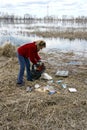 Woman collecting rubbish in nature