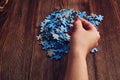 Woman collecting the small pieces of a puzzle - the concept of problem-solving Royalty Free Stock Photo