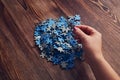 Woman collecting the small pieces of a puzzle - the concept of problem-solving Royalty Free Stock Photo