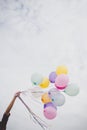 Woman with colorful balloons outside blue sky. Royalty Free Stock Photo