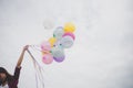 Woman with colorful balloons outside blue sky Royalty Free Stock Photo