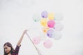 Woman with colorful balloons outside blue sky Royalty Free Stock Photo