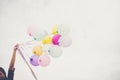 Woman with colorful balloons outside blue sky