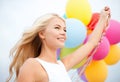 Woman with colorful balloons outside Royalty Free Stock Photo