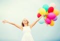 Woman with colorful balloons outside Royalty Free Stock Photo