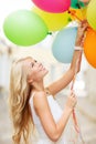 Woman with colorful balloons Royalty Free Stock Photo