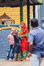 A woman and her kids worshiping at a Narasimha Hindu temple in Visakhapatnam, India