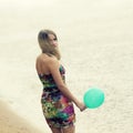 Woman with colorful latex balloon