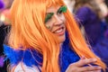 Woman with a colorful orange wig