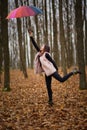 Woman with umbrella dragged by the wind