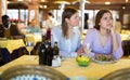 Woman comforting her upset female friend in restaurant Royalty Free Stock Photo