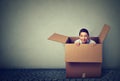 Woman coming out from a box Royalty Free Stock Photo