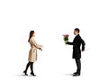 Woman coming to man with flowers and knife