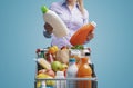 Woman comparing products at the supermarket Royalty Free Stock Photo