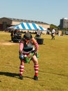 Woman competing in Weight of height strength test at Scottish Highland games getting ready to throw weight over high bar Tulsa Okl