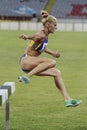 Woman competitor at 3000m steeplechase Royalty Free Stock Photo