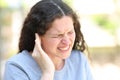 Woman complaining suffering ear ache Royalty Free Stock Photo
