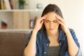 Woman complaining suffering migraine at home