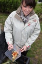 Woman composting vegetables