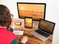 Woman with computers and mobile devices