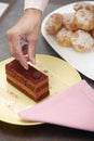 Woman confectioner preparing cake