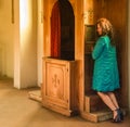 Woman confessing at the confessional