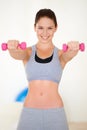 Woman, confident or portrait by dumbbells in studio, health wellness or fitness in weight loss of exercise. Young person Royalty Free Stock Photo