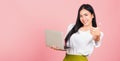 Woman confident smiling face holding using laptop computer and showing thumb up Royalty Free Stock Photo
