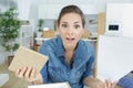 woman confused about furniture plans Royalty Free Stock Photo
