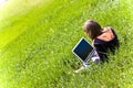 Woman connected on the grass