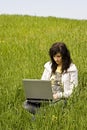 Woman connected on the grass