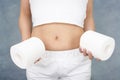 Woman with roll of toilet papers