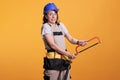 Woman construction worker holding hand saw Royalty Free Stock Photo