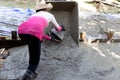 Woman construction worker poured concrete floors